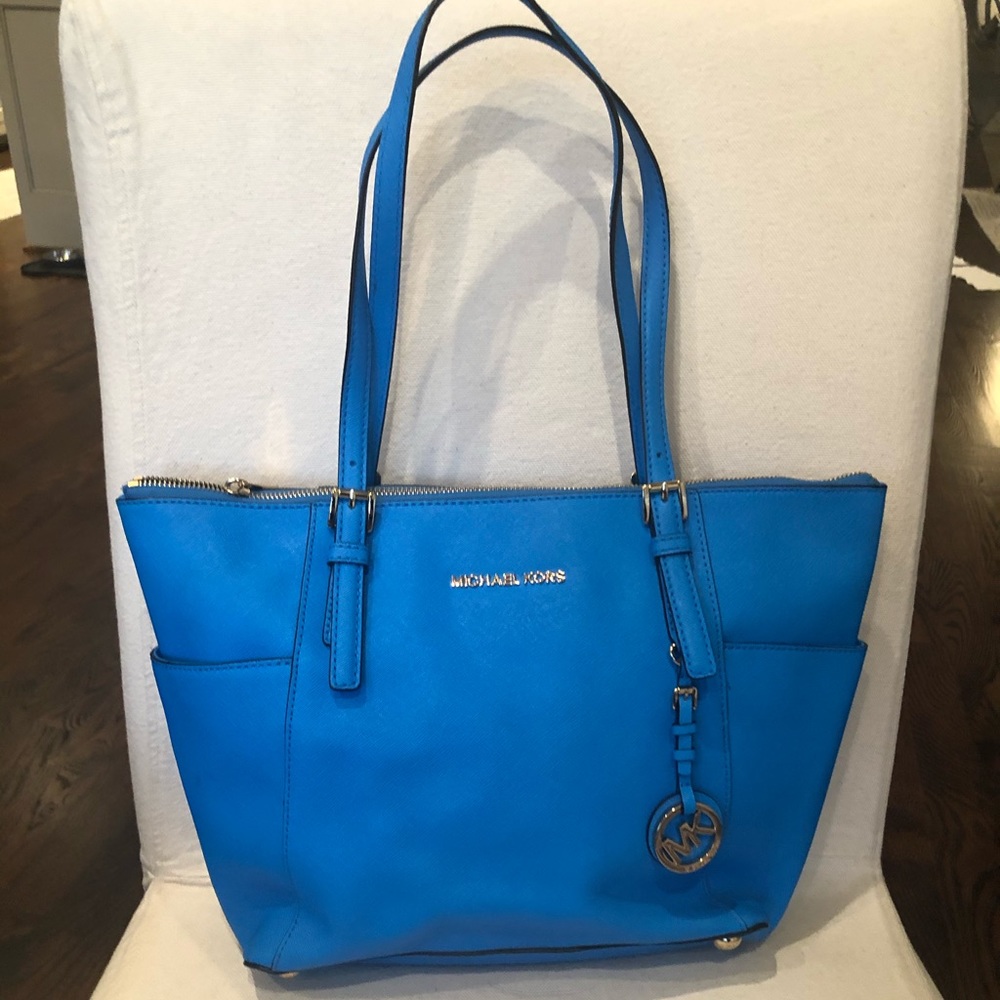 Bright blue Michael Kors purse, new without tags